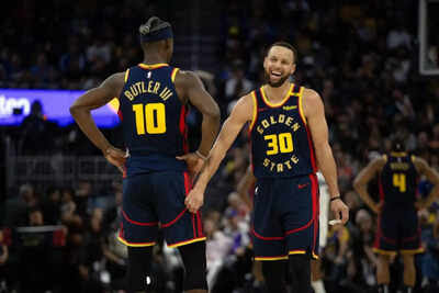 golden-state-warriors-forward-jimmy-butler-iii-10-and-guard-stephen-curry-30-share-a-laugh-during-the-second-quarter-against-the-sacramento-kings-at-chase-center